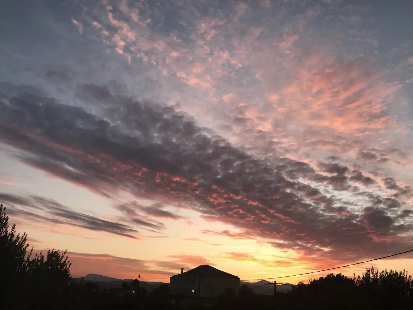 Sunrize over the city skyline with warm mornig light.